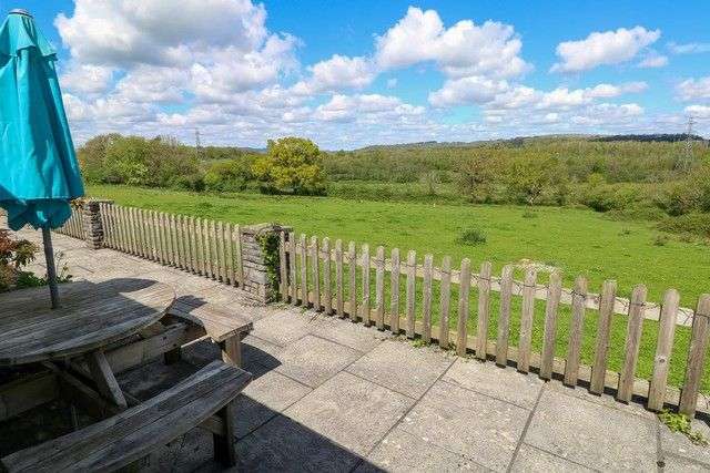 Garden patio and furniture at Bluebell Cottage wit countryside views.