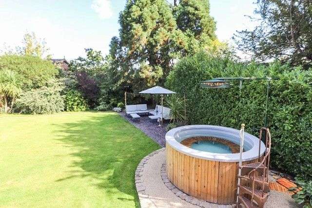 Garden with hot tub at Mickle Trafford Manor.