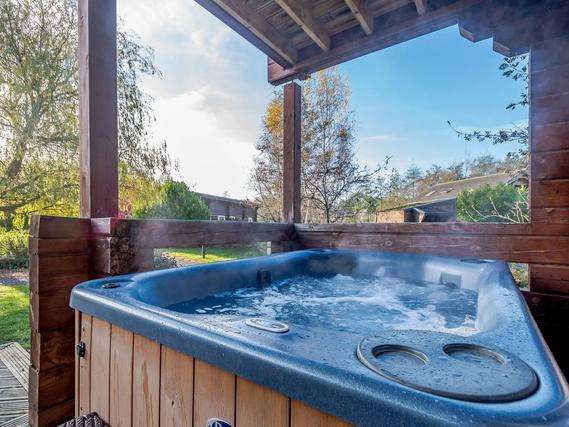 Hot tub and garden decking at Birch Waterside Spa.