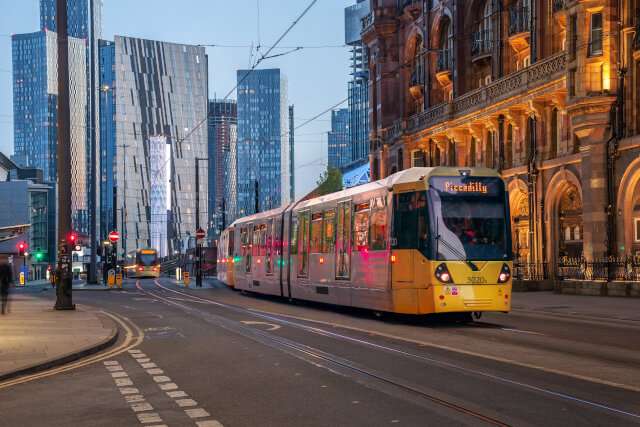 Metrolink tram in Manchester, with the Deansgate development in the background.