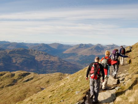 Hikers walking up a mountain.