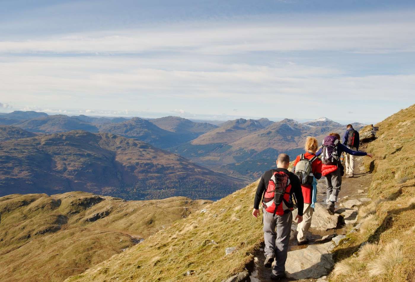 Hikers walking up a mountain.