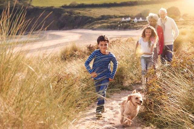 family with their dog on a uk holiday
