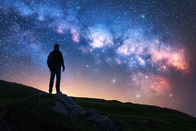 Man looking out at the stars at night