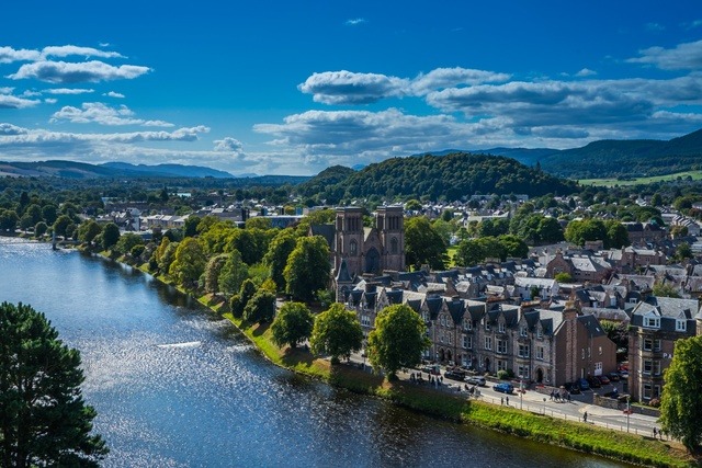 Aerial view of Inverness overlooking the River Ness and historic buildings in the Scottish Highlands.