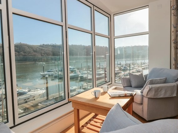 Living area with marina views from 33 Dart Marina.