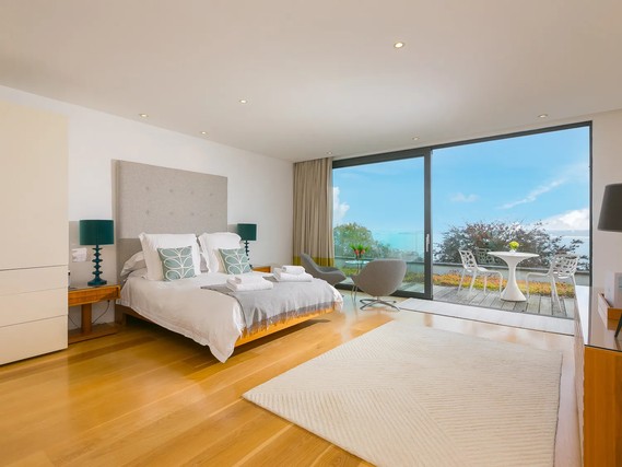 Bedroom in Salt House with coastal views.