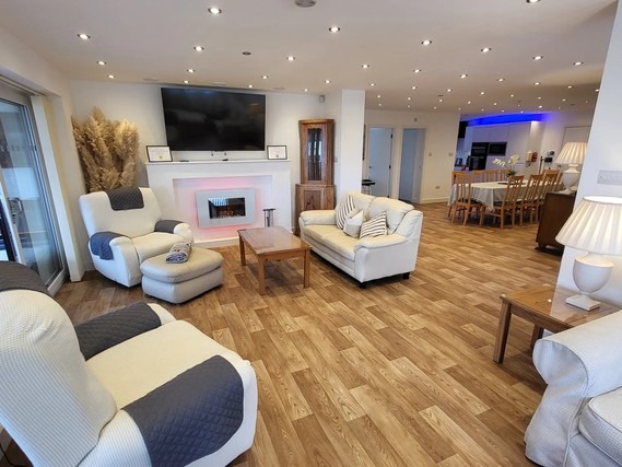Open-plan living space in Top Of The Lane Luxury Holiday Apartment.