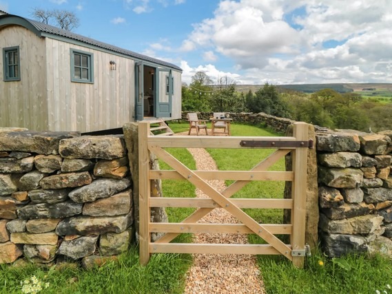 Exterior of Sheep Cote Shepherds Hut and enclosed garden.