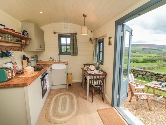 Open-plan living space in Sheep Cote Shepherds Hut.