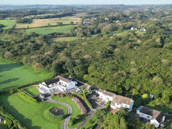 Aerial view of Top Of The Lane Luxury Holiday Apartment and the surrounding countryside.