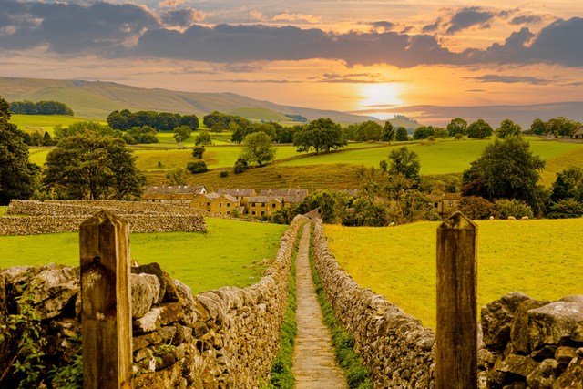 A view of Grassington, North Yorkshire, with fields around it.