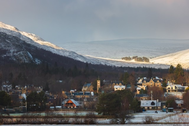 Kingussie, Highlands with mountains behind it.
