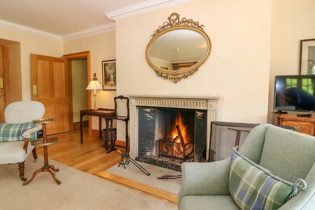 Living area with an open fire at Claybokie.