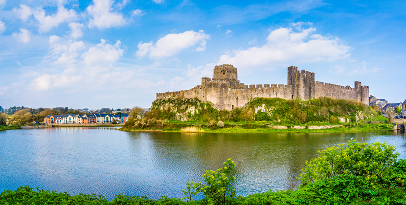 Landscape with the ruins of Pembroke Castle on the shores of river Pembroke, the original family seat of the Earldom of Pembroke