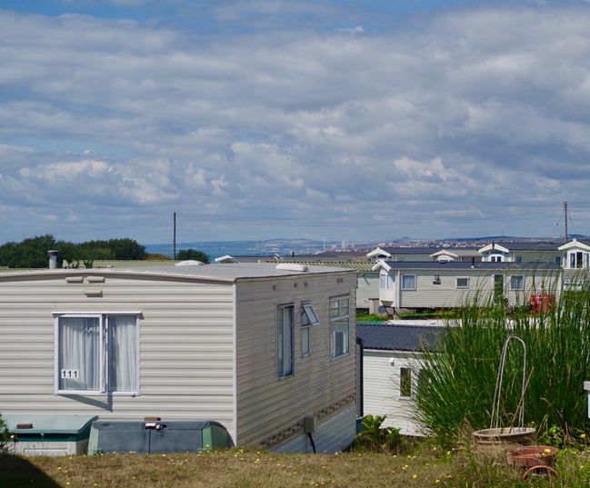 View of the English Channel on a sunny summers day from Sunnyside Caravan park  in Peacehaven, England, UK.