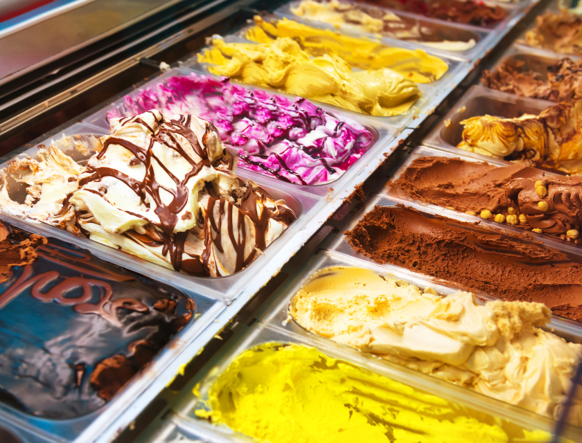 Parisella’s Ice Cream Parlour is a popular attraction near Conwy Morfa Beach. Close up of the counter at an ice cream parlour. Several flavours are visible.