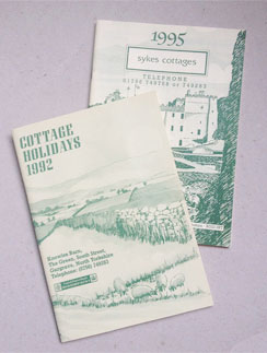 Photo of brochures from 1992 and 1995