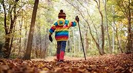 Boy walking in the woods, enjoying the countryside