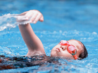 Swimming at West Bay Club and Spa
