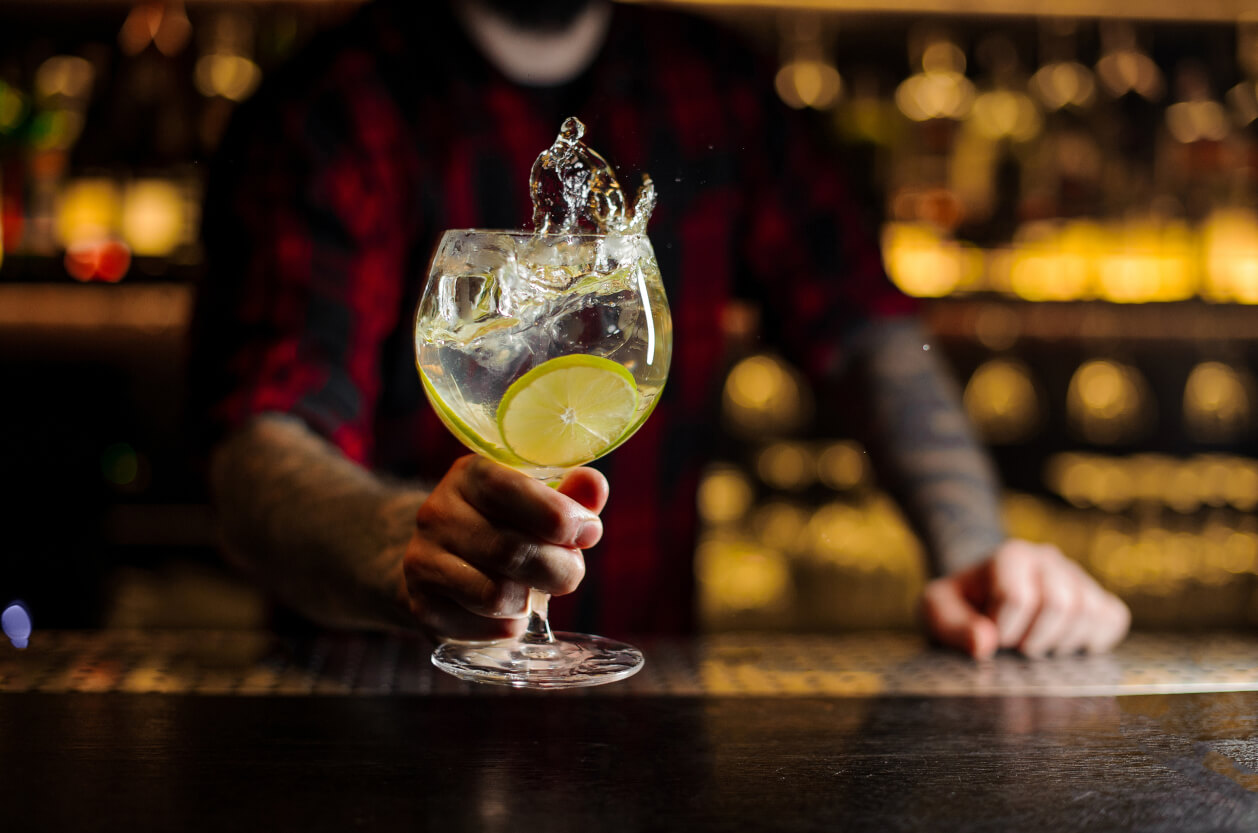 Bartender serving gin