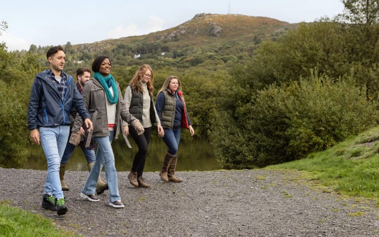 Group of adults walking in countryside