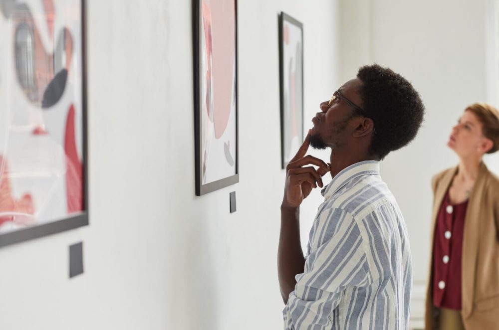 man in art gallery