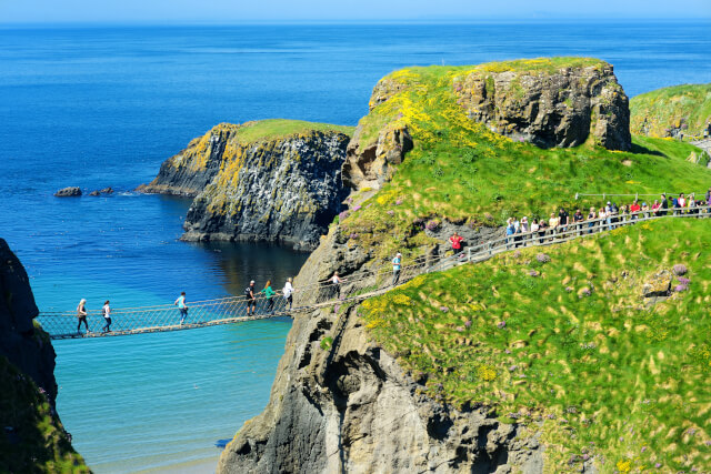 People venturing across Carrick a Rede Rope Bridge