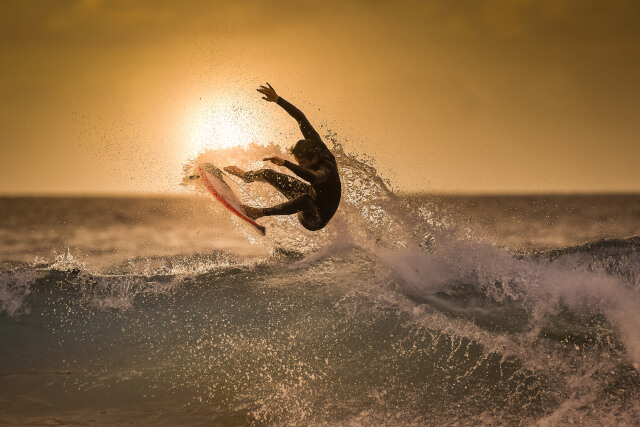Surfer jumping