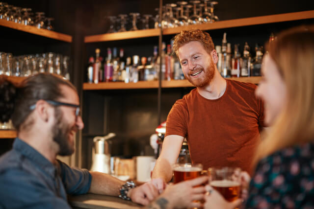 Bartender with customers