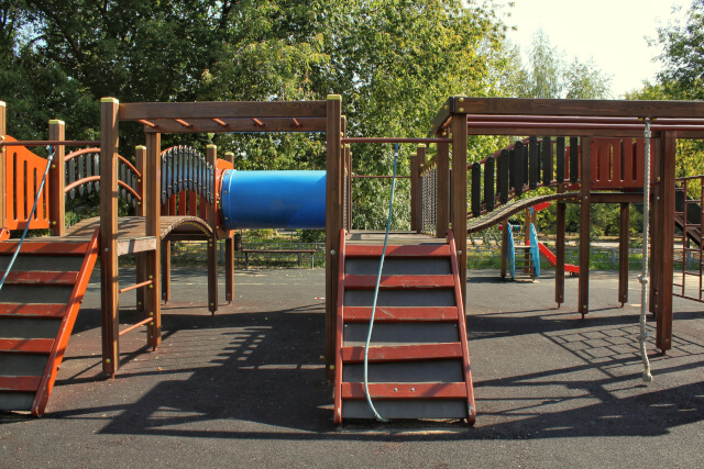 a playground with a climbing frame