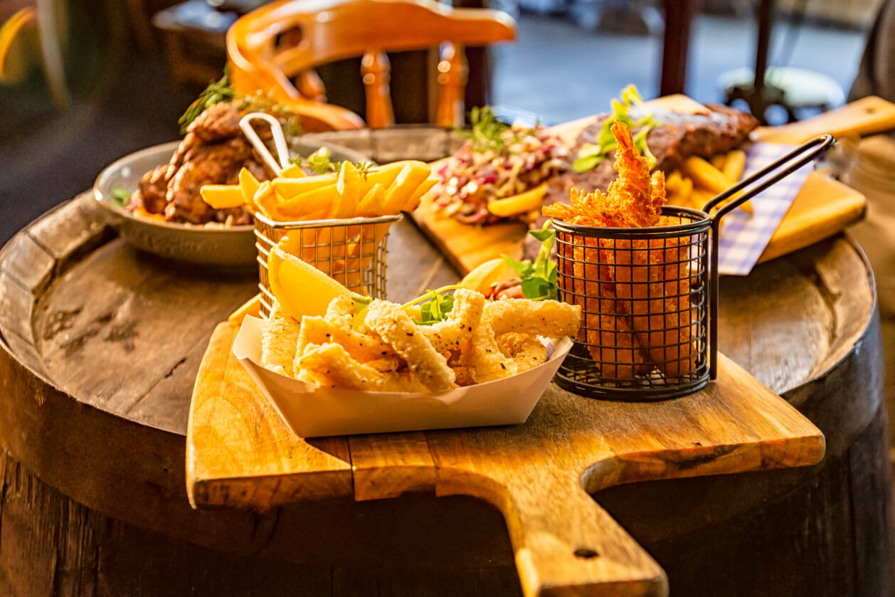 an array of hearty dishes, such as chips and steak