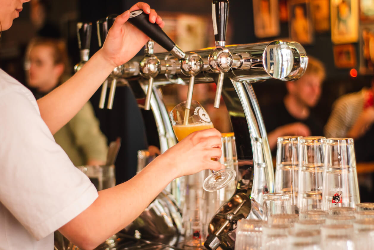 bartender pouring a pint