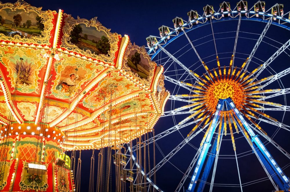 carousel and ferris wheel in the night