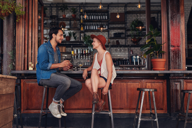 couple sat at a bar together