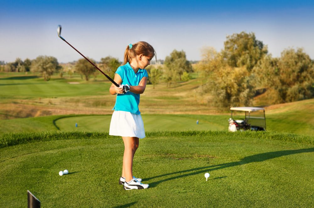 girl playing golf