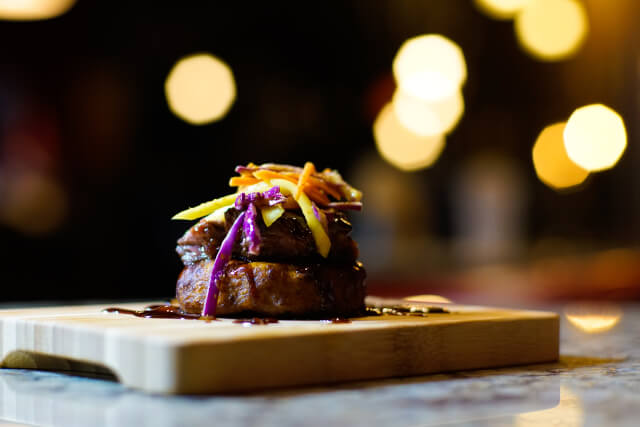 gourmet meat dish on a wooden board