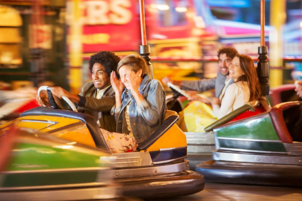 group of four friends enjoying the dodgems