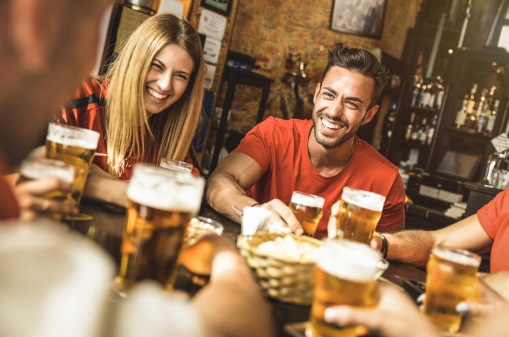 group of friends enjoying pints in the pub