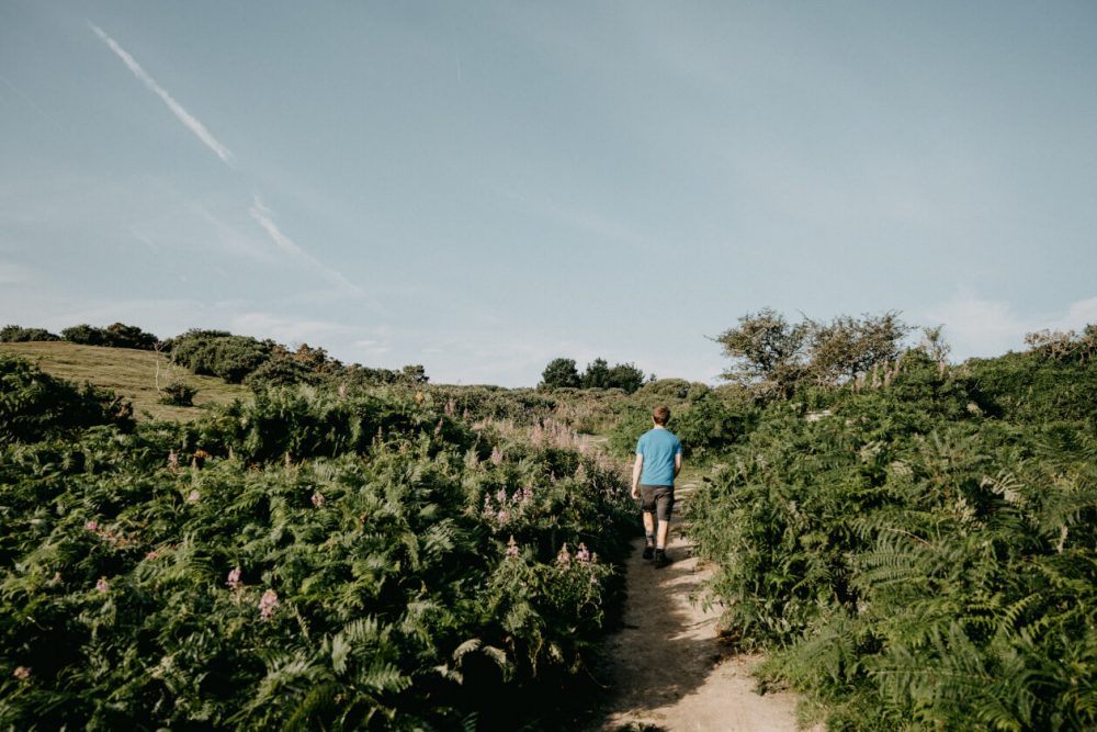 guy hiking through the countryside