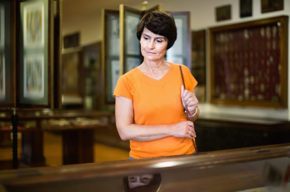 lady looking around museum