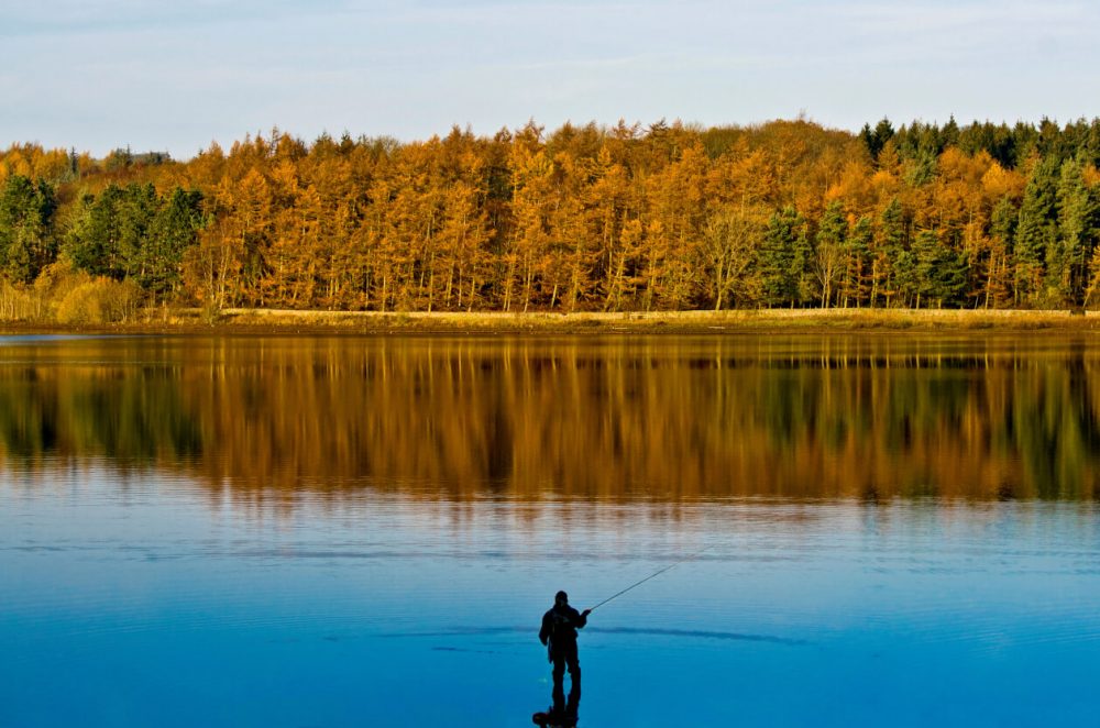 man fishing at fewston reservoir