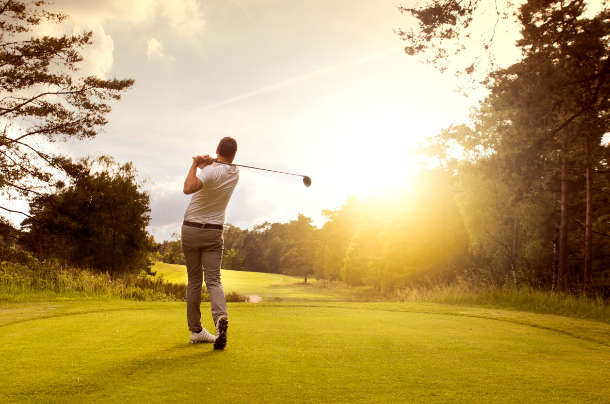 man playing golf at teeoff