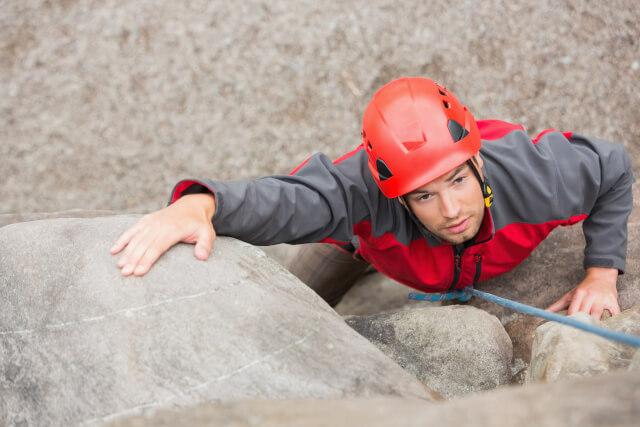 man rock climbing