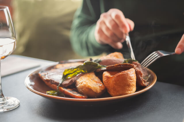 person eating a sunday roast