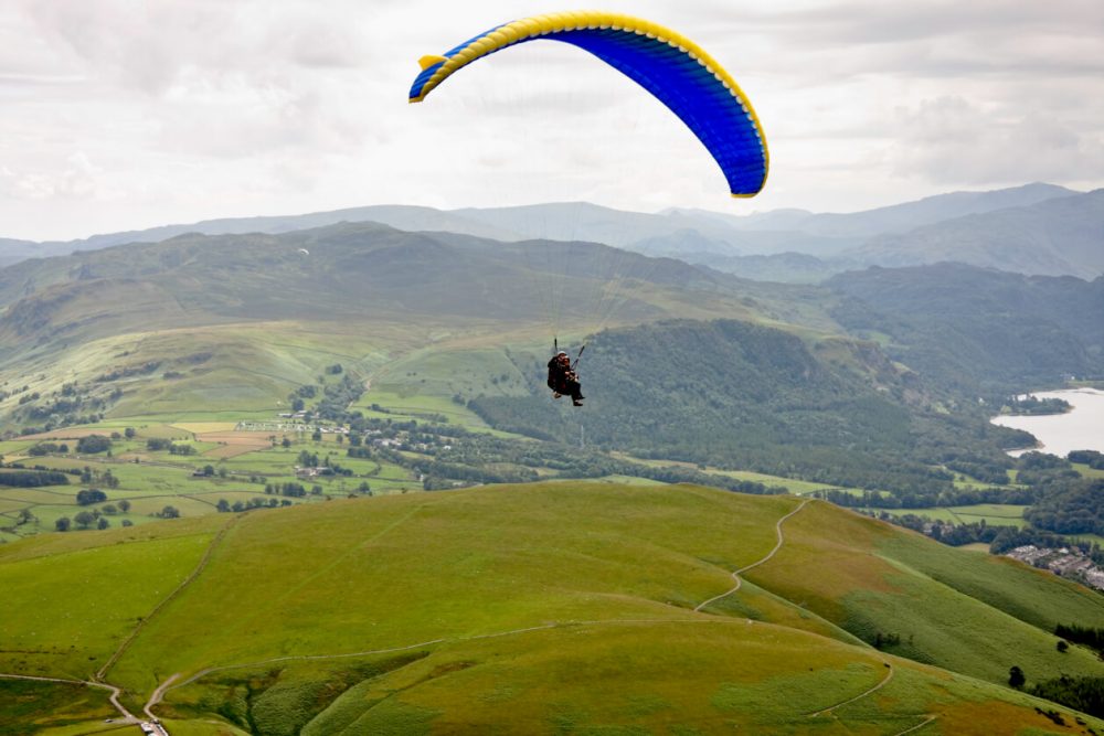 person paragliding in the lake district