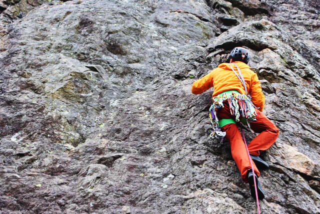 person rock climbing