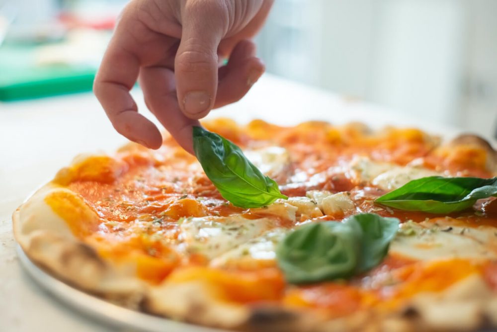 pizza with basil garnish