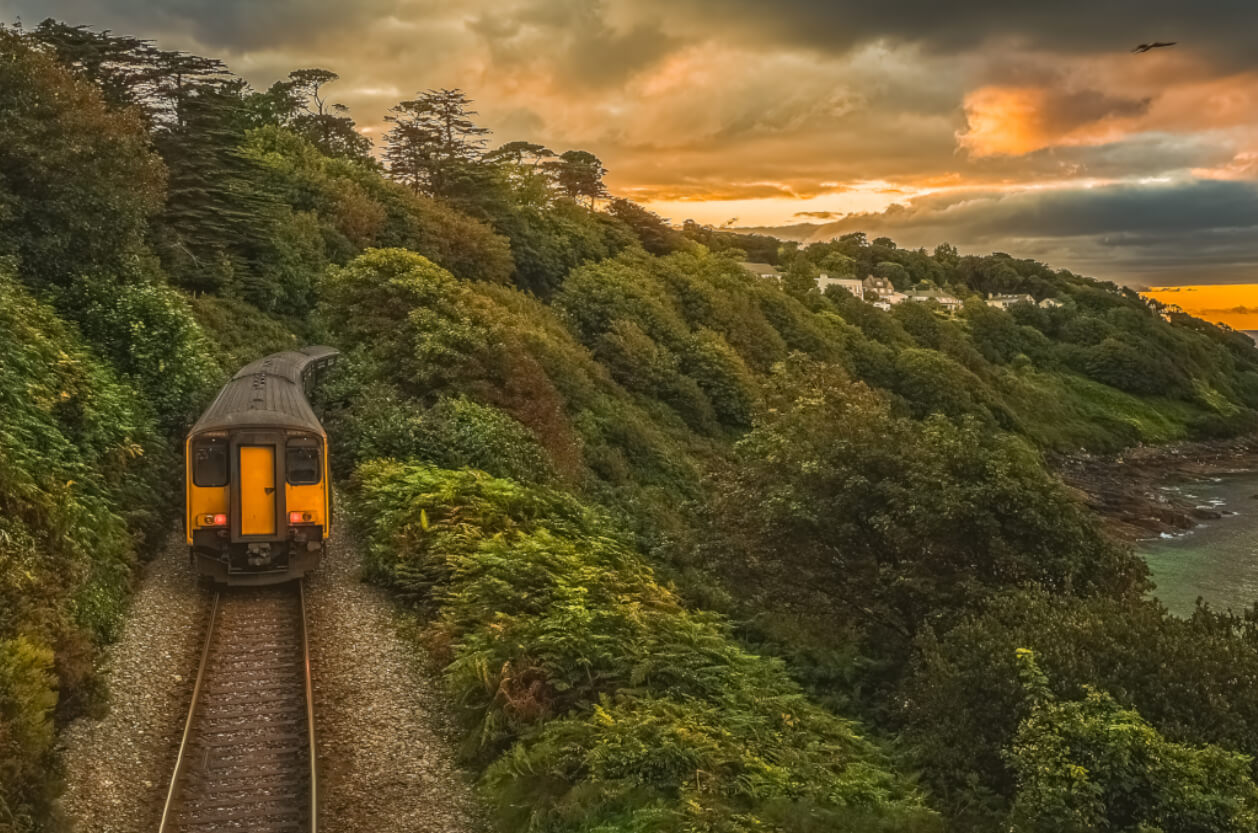 train running along Cornish coast