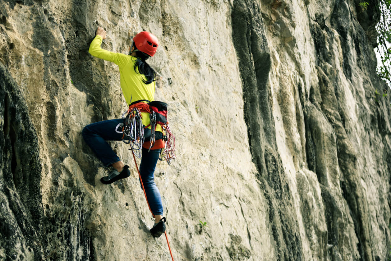 woman rock climbing